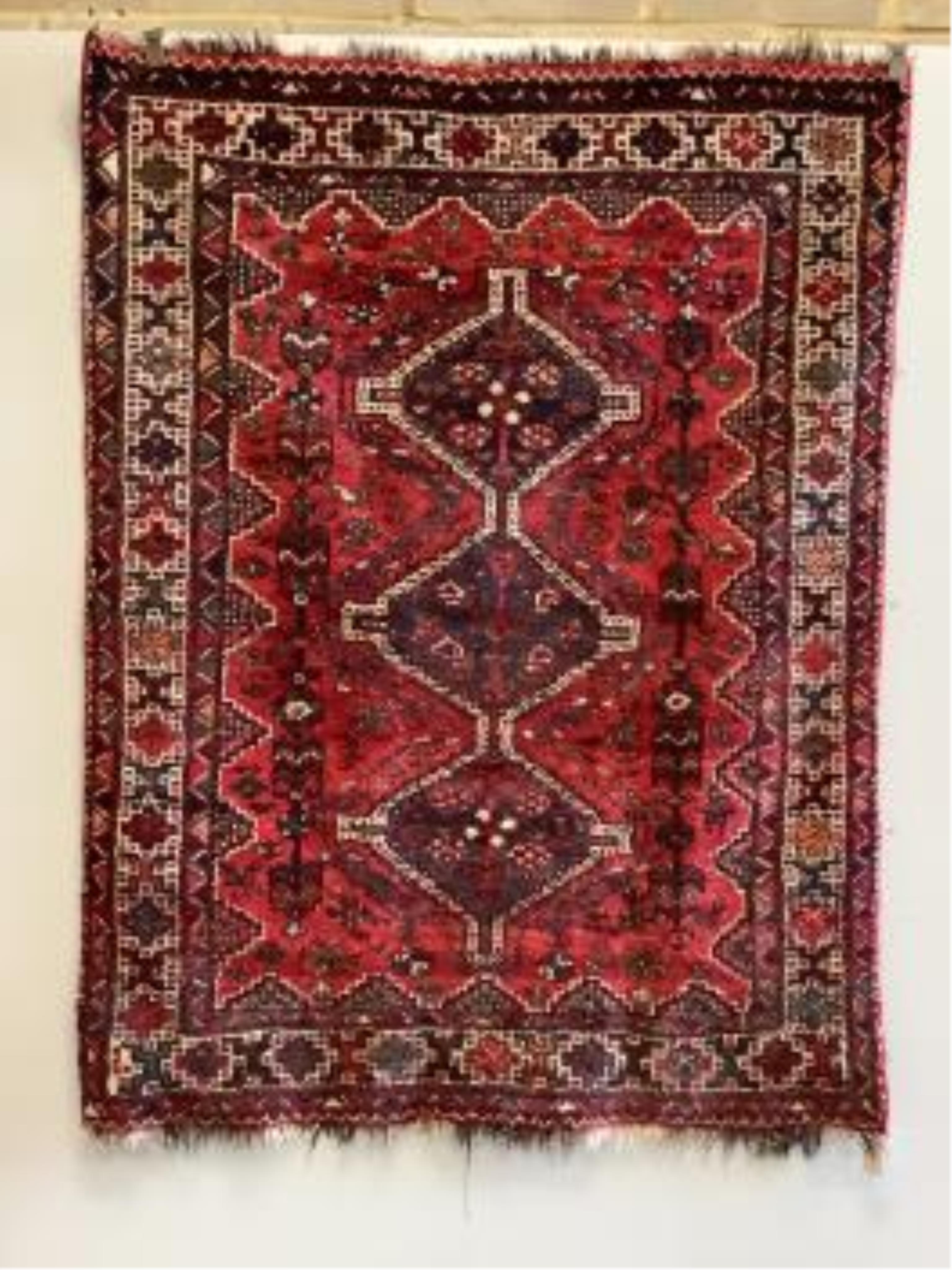A Hamadan red ground rug, 196 x 154cm. Condition - poor to fair